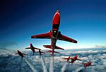 Photography of Red Arrows air to air at the top of a loop