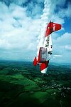 Photography of Marlboro aerobatics aircraft in steep dive
