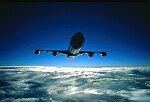 Photography of A340 Airbus air to air head on above the cloud silhouette