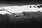 Photography of A.S.H. 25 glider above clouds wave soaring 