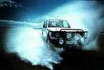 Photography of Shogun 4 x 4 splashing through sea