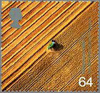 Photography of combine harvester at work, used for Millennium postage stamp
