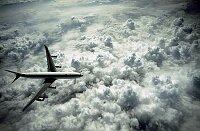 Airbus A340 flying above the clouds.