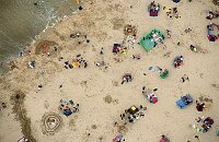 Holidaymakers on the beach at Newquay Cornwall.